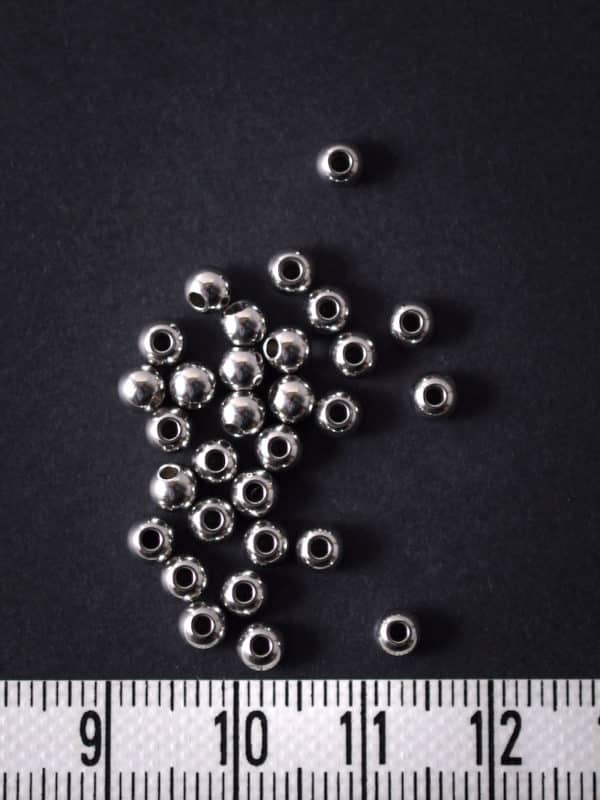 Perles d'acier inoxydable 4 mm (trou 1,2 mm)